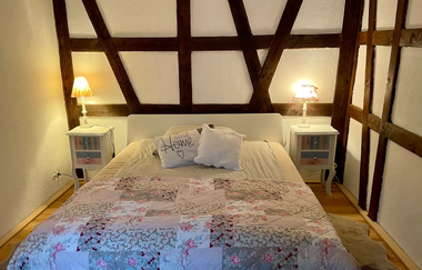 Schlafzimmer 1 in Die Fachwerkhütte | © Die Fachwerkhütte